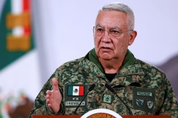 Mexico's Defense Minister Ricardo Trevilla Trejo speaks during a press conference about the wave of violence in Mexico, following the killing of Mexican drug lord Nemesio Oseguera, known as 'El Mencho', in a military operation on Sunday, at Palacio Nacional, in Mexico City, Mexico, February 23, 2026. REUTERS/Raquel Cunha