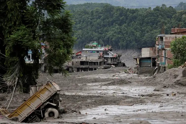 Mud covers houses and a road following a flash flood at Trishuli in Nuwakot district, Nepal, August 26, 2026. REUTERS/Navesh Chitrakar