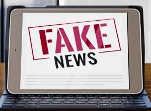 front-view-laptop-desk-with-fake-news_0.jpg